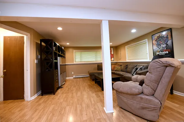a living room with furniture and a walk in closet