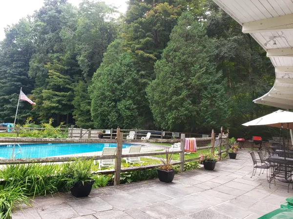 an outdoor space with furniture and umbrella