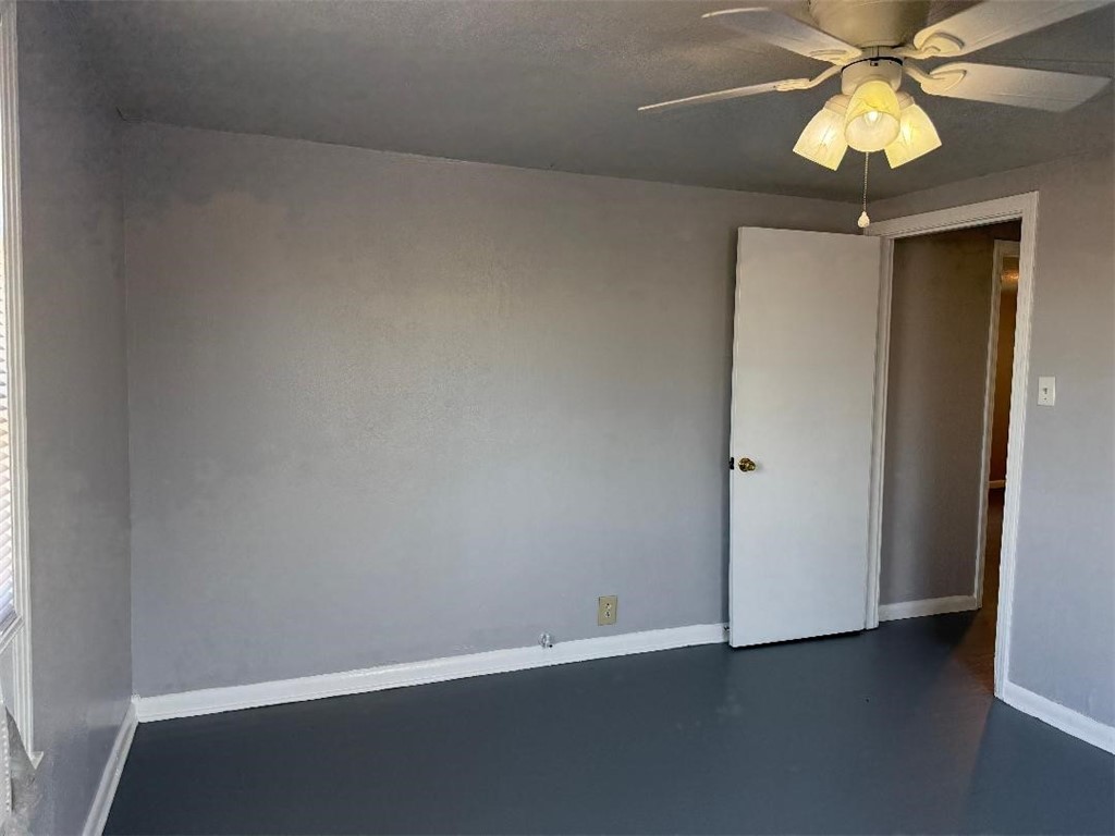 810 8th Avenue Portland, TX 78374 - Photo 15 of 16 an empty room with a chandelier fan and a chandelier fan