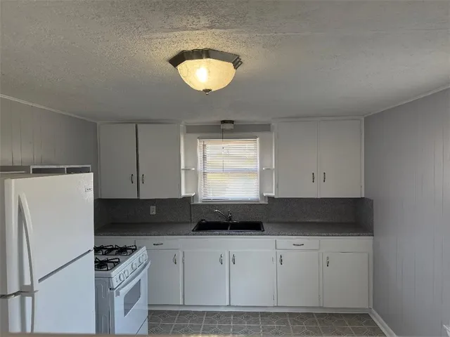 a room with a sink and a window
