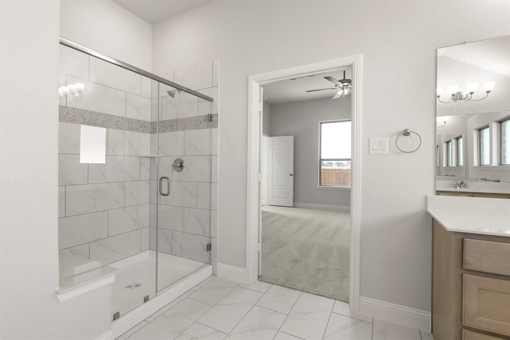 395 Misty Meadow Lane Lavon, TX 75166 - Photo 12 of 24 a bathroom with a shower and a sink