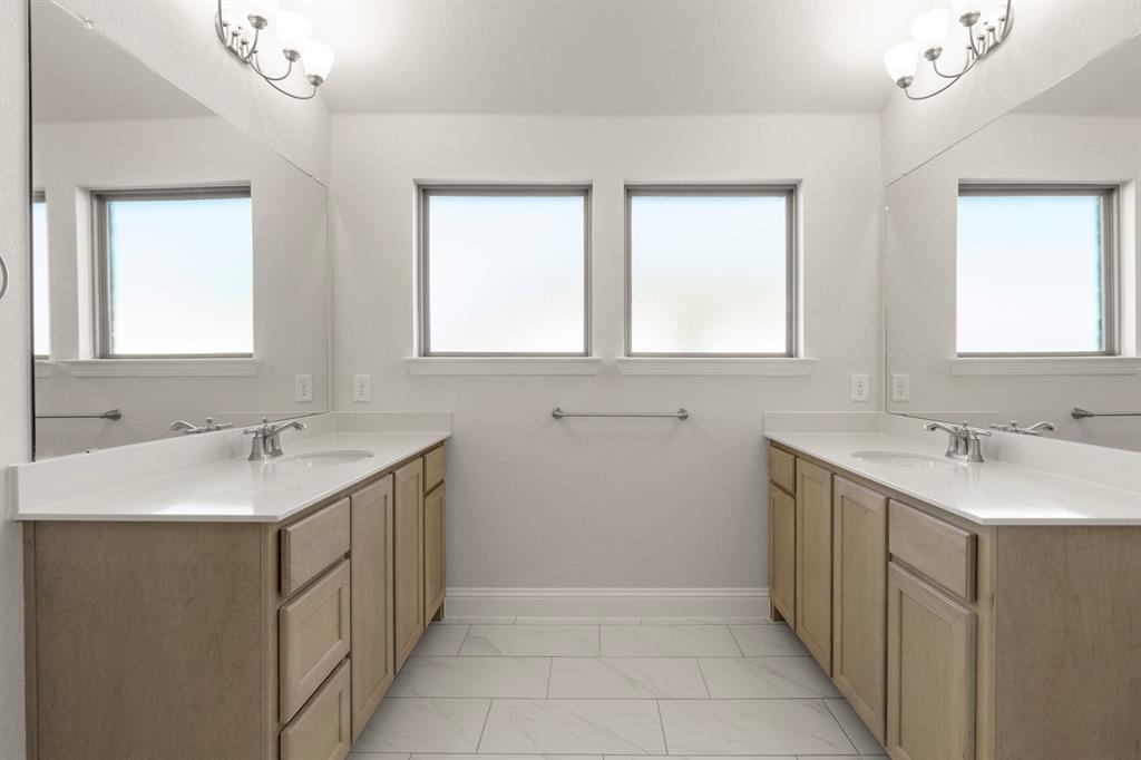 395 Misty Meadow Lane Lavon, TX 75166 - Photo 14 of 24 a bathroom with a sink and a mirror