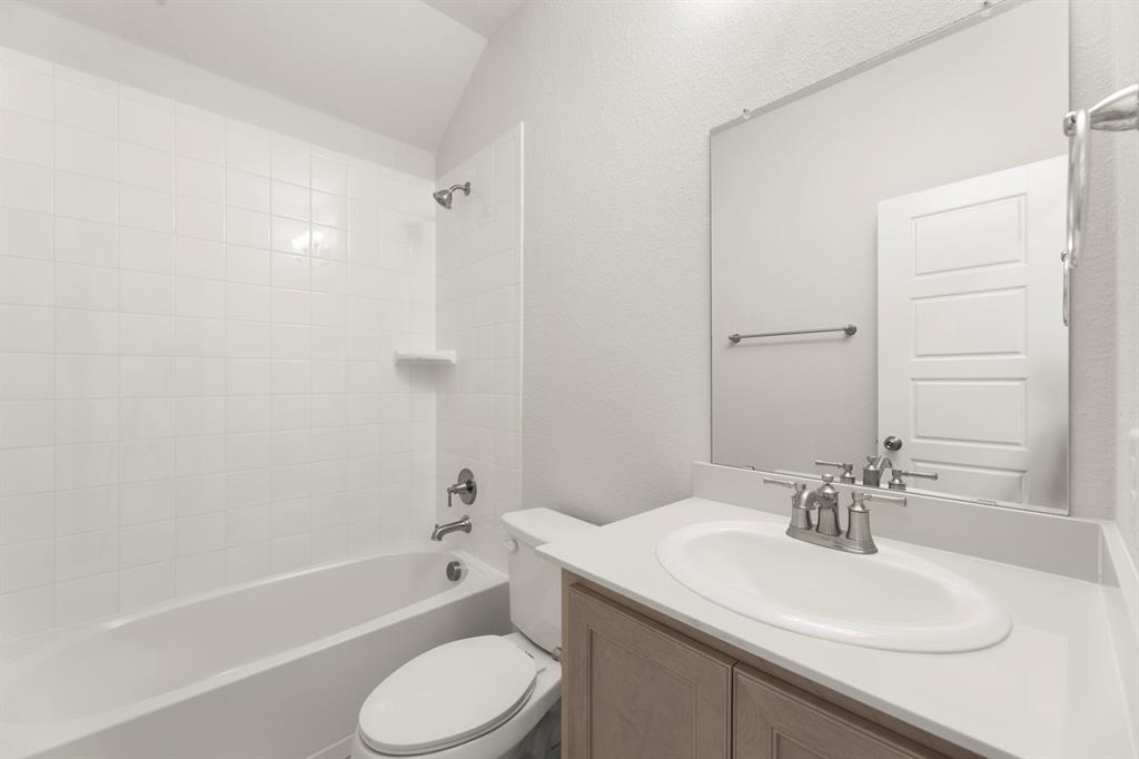 395 Misty Meadow Lane Lavon, TX 75166 - Photo 20 of 24 a bathroom with a sink toilet tub and shower