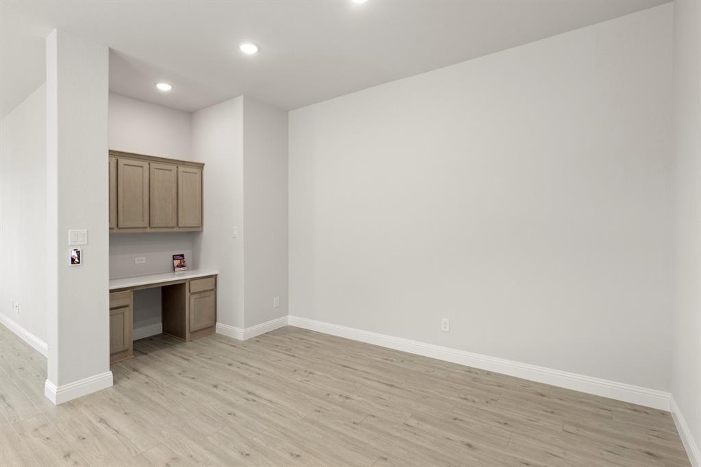 395 Misty Meadow Lane Lavon, TX 75166 - Photo 6 of 24 a view of a kitchen with a sink and a stove top oven