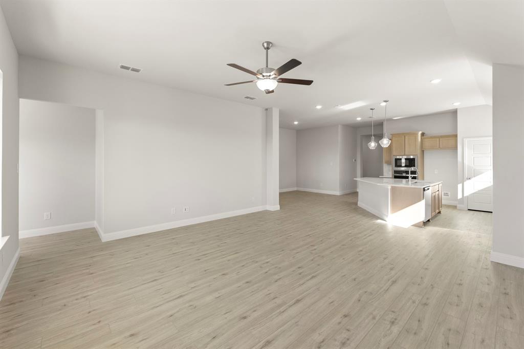 395 Misty Meadow Lane Lavon, TX 75166 - Photo 7 of 24 a view of an empty room and kitchen view