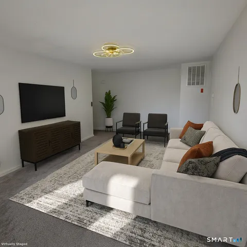 a living room with furniture and a window