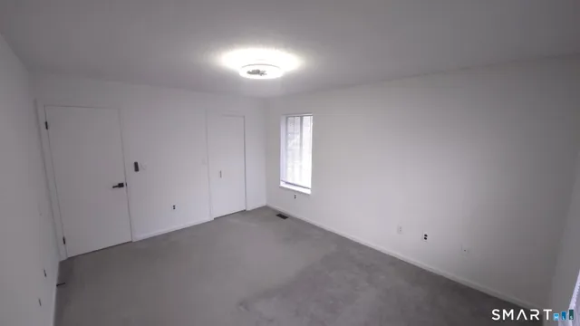 a view of a lake with a house in the background