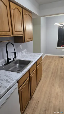 an empty room with chandelier fan