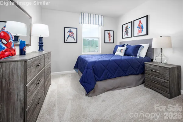 a spacious bedroom with a bed and a dresser