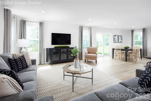 a living room with furniture or couch and a flat screen tv