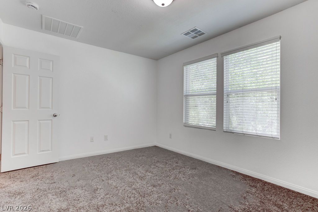 4650 Ranch House Road, Unit 47 North Las Vegas, NV 89031 - Photo 22 of 43 A well-lit bedroom offering a blank canvas for personalization.