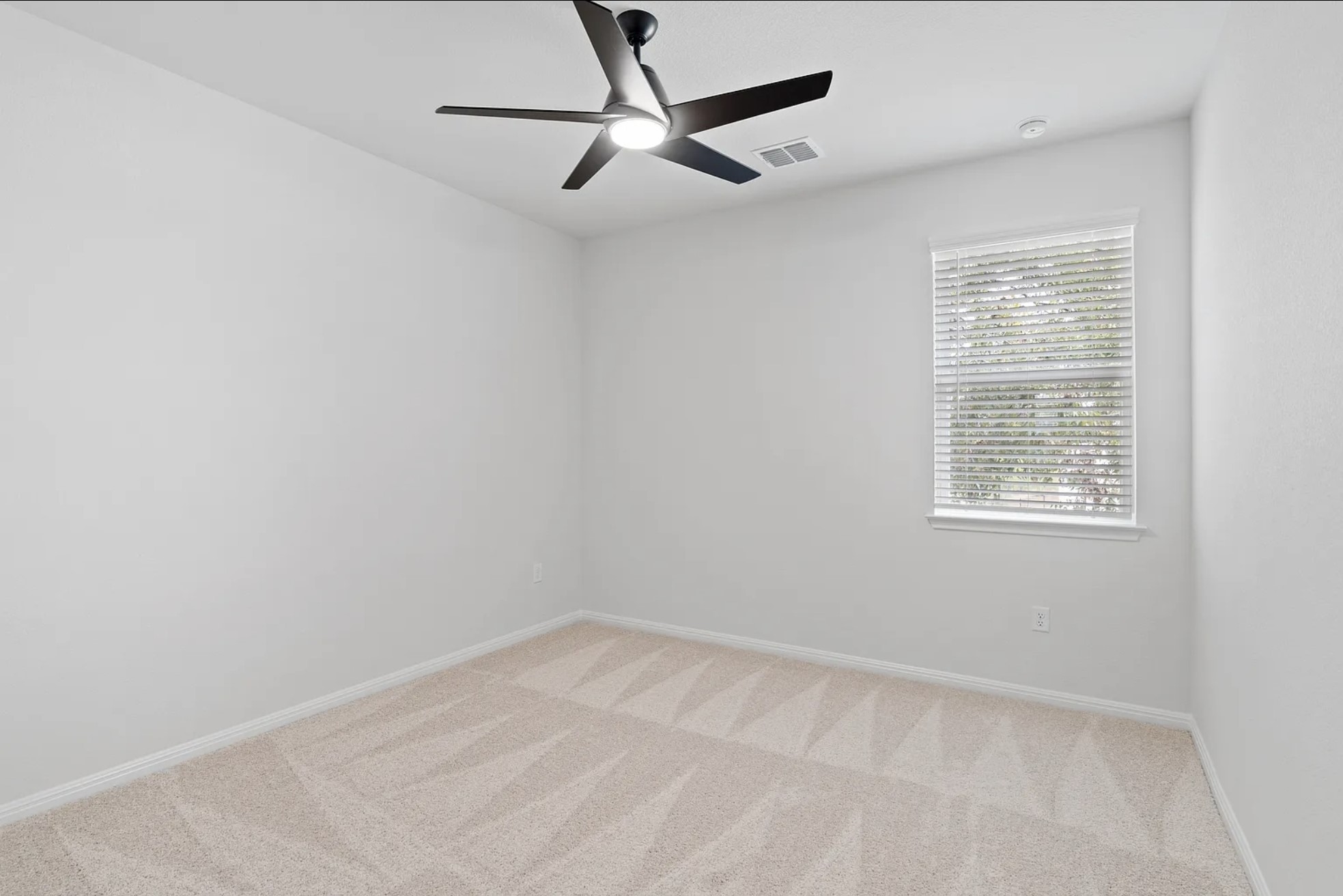 1612 Kit Circle Austin, TX 78758 - Photo 15 of 29 an empty room with a window and a fan