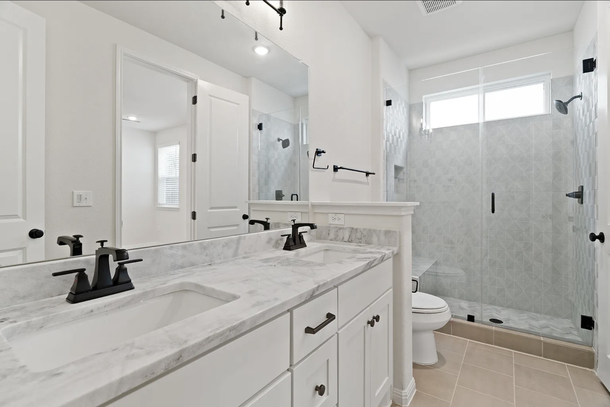 1612 Kit Circle Austin, TX 78758 - Photo 24 of 29 a bathroom with a granite countertop sink a toilet and shower