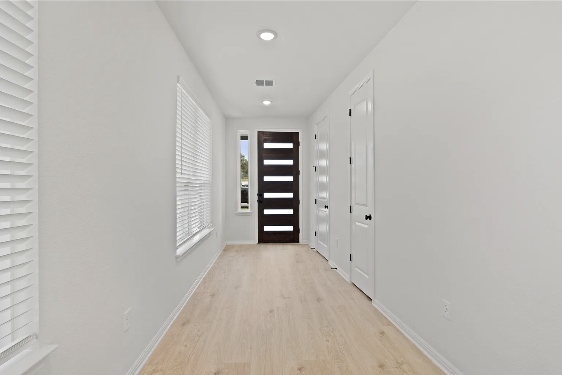 1612 Kit Circle Austin, TX 78758 - Photo 4 of 29 a view of wooden floor and windows in a room