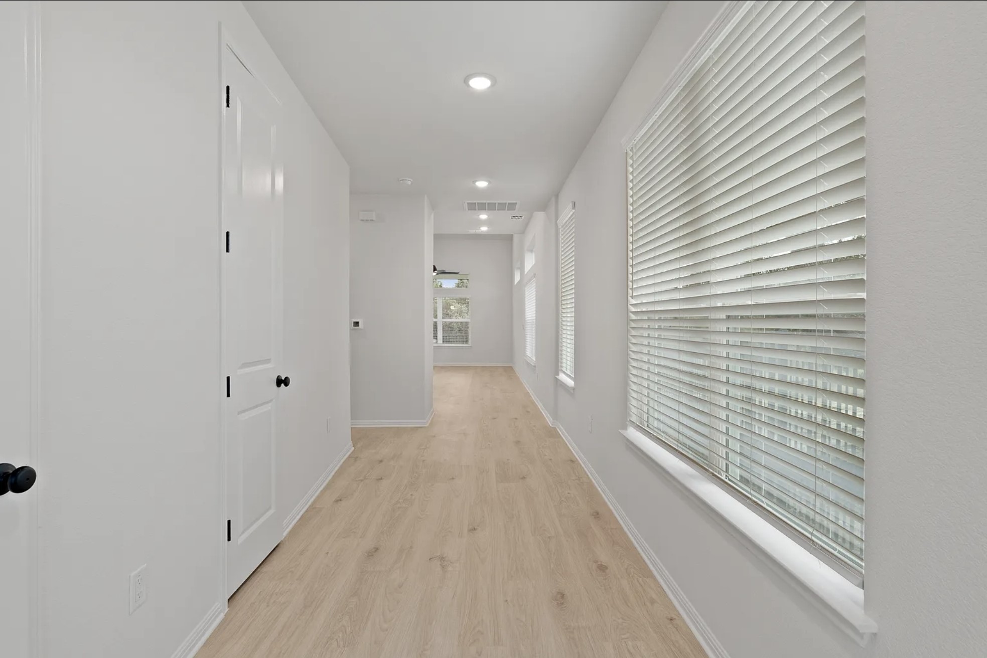 1612 Kit Circle Austin, TX 78758 - Photo 5 of 29 a view of a hallway with wooden floor