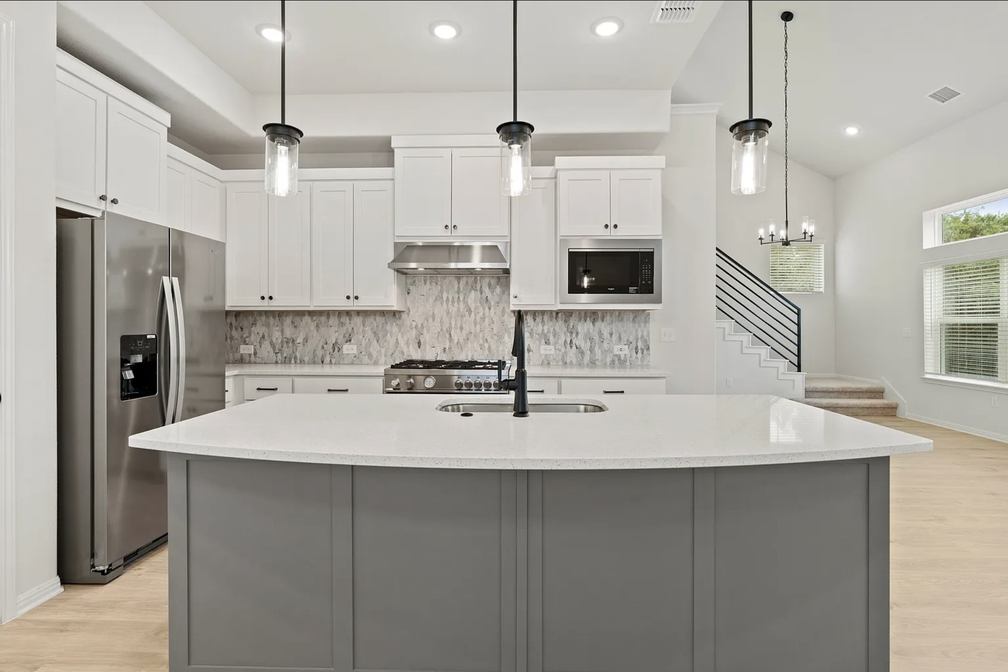 1612 Kit Circle Austin, TX 78758 - Photo 8 of 29 a kitchen with kitchen island a sink stainless steel appliances and cabinets