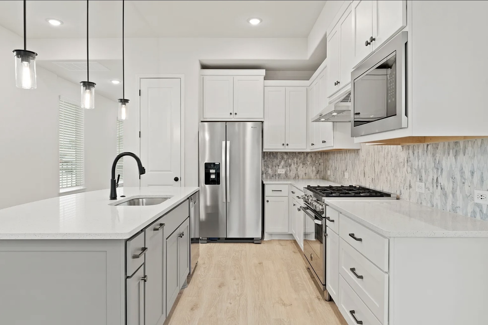 1612 Kit Circle Austin, TX 78758 - Photo 10 of 29 a kitchen with stainless steel appliances granite countertop a sink stove and refrigerator