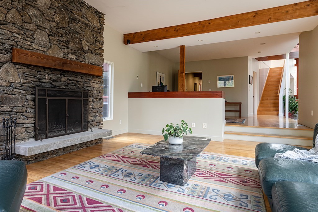3 Barberry Road Lexington, MA 02421 - Photo 16 of 42 a living room with furniture and a fireplace
