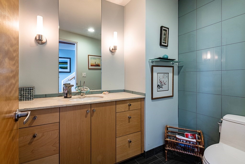 3 Barberry Road Lexington, MA 02421 - Photo 17 of 42 a bathroom with a toilet sink and mirror