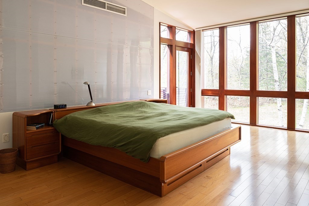 3 Barberry Road Lexington, MA 02421 - Photo 20 of 42 a bedroom with a bed and a large window