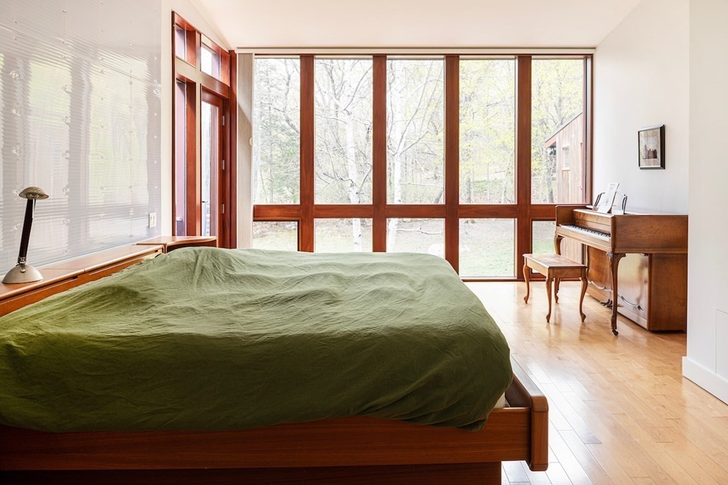 3 Barberry Road Lexington, MA 02421 - Photo 21 of 42 a bedroom with a bed and a large window