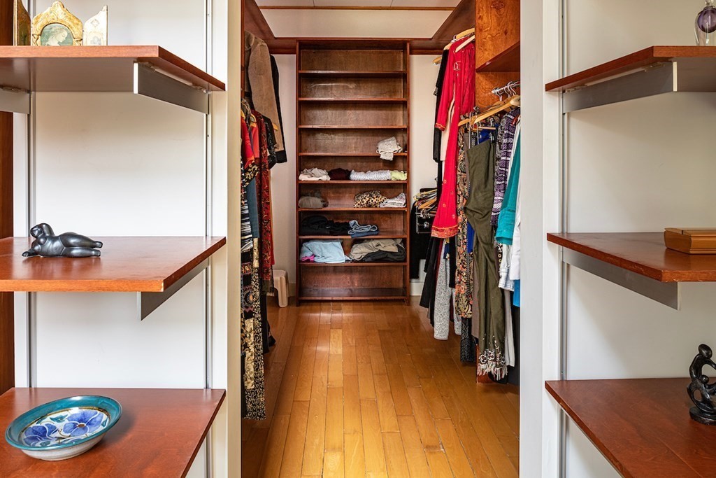 3 Barberry Road Lexington, MA 02421 - Photo 24 of 42 a view of walk in closet with clothes and shoes