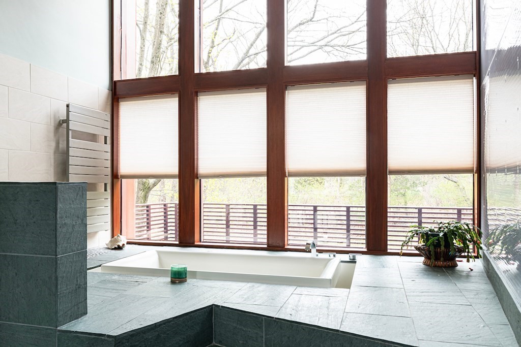3 Barberry Road Lexington, MA 02421 - Photo 27 of 42 a view of an empty room with wooden floor and a window
