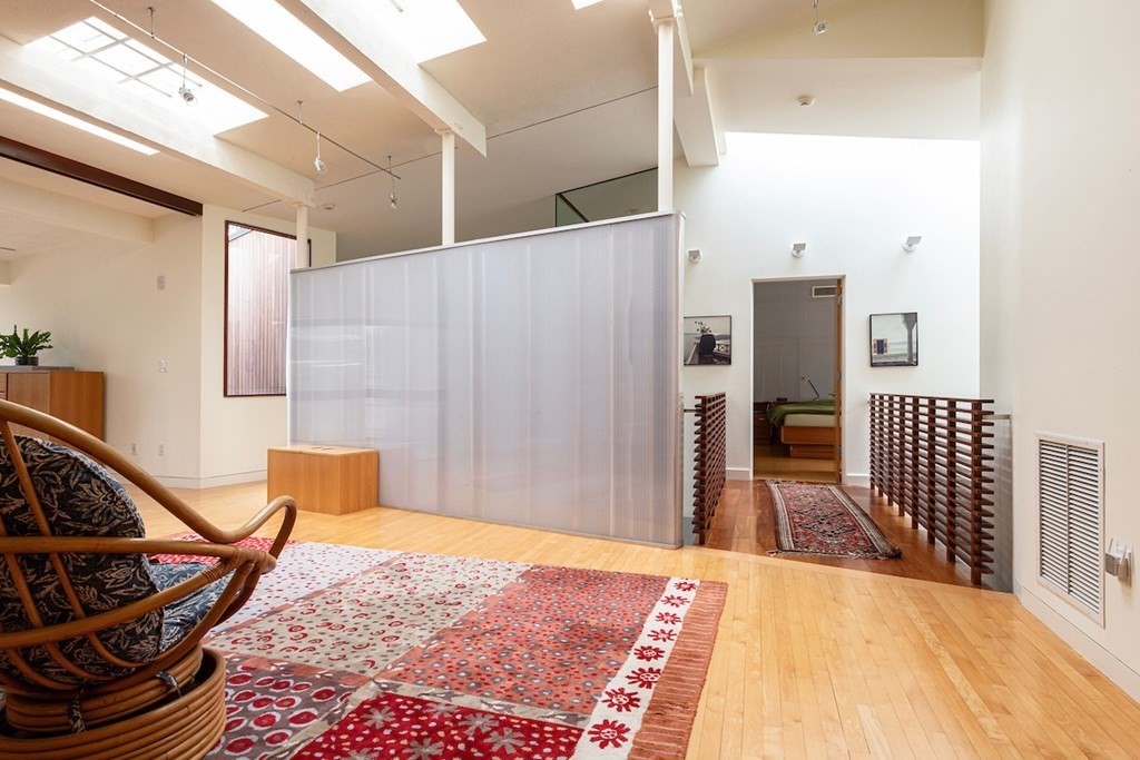 3 Barberry Road Lexington, MA 02421 - Photo 30 of 42 a bedroom with a bed and wooden floor