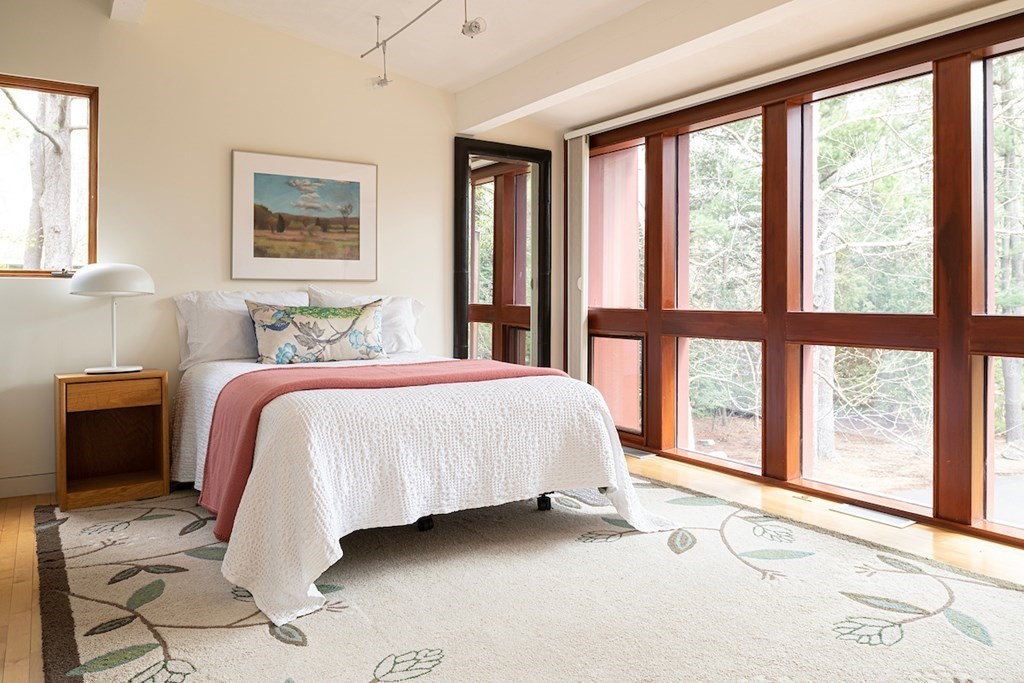 3 Barberry Road Lexington, MA 02421 - Photo 31 of 42 a bed sitting in a bedroom next to a window