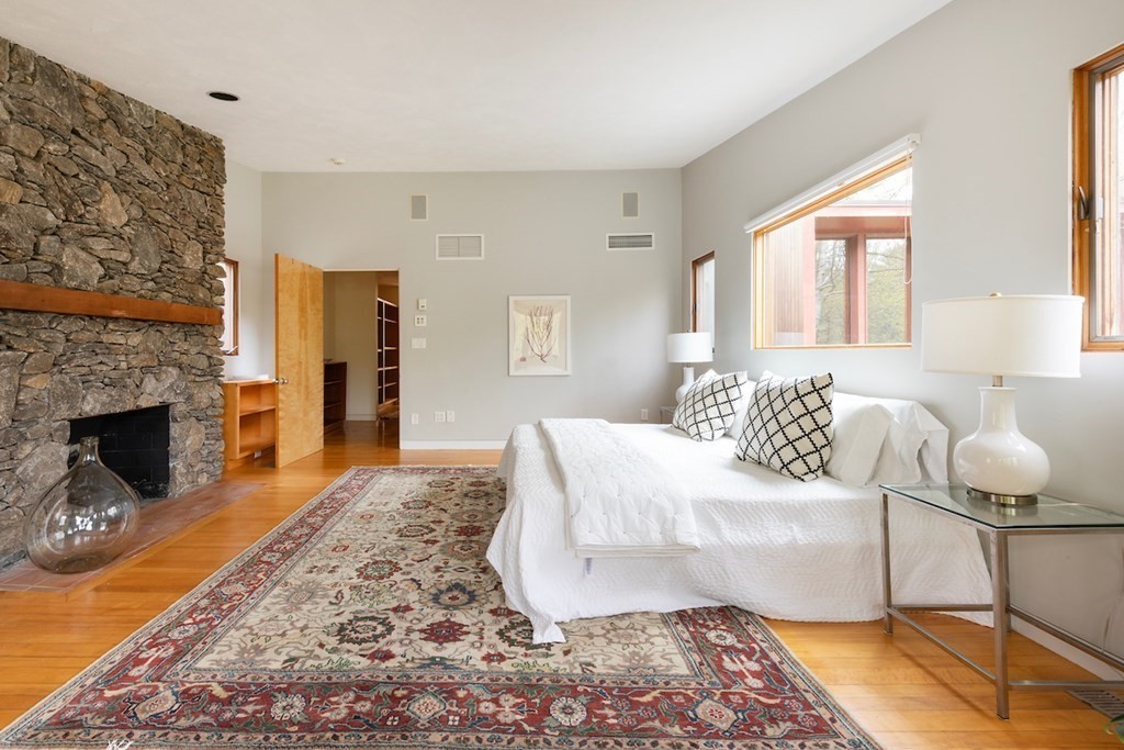 3 Barberry Road Lexington, MA 02421 - Photo 32 of 42 a living room with furniture and a fireplace