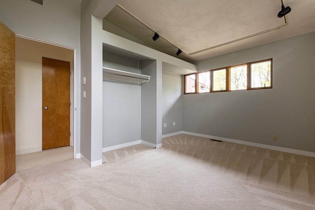 3 Barberry Road Lexington, MA 02421 - Photo 37 of 42 a view of an empty room with a window