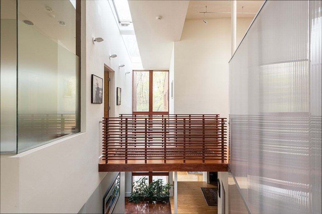 3 Barberry Road Lexington, MA 02421 - Photo 9 of 42 a view of a hallway with wooden floor and staircase