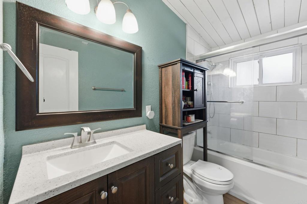 9838 Ivanho Street Spring Valley, CA 91977 - Photo 13 of 25 a bathroom with a sink a toilet and shower