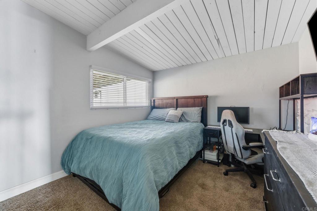 9838 Ivanho Street Spring Valley, CA 91977 - Photo 14 of 25 a bed sitting in a bedroom next to a window