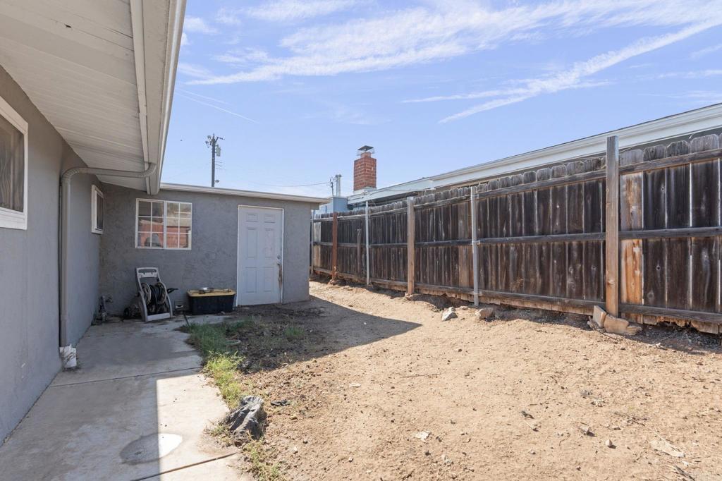 9838 Ivanho Street Spring Valley, CA 91977 - Photo 21 of 25 a front view of a house with a yard