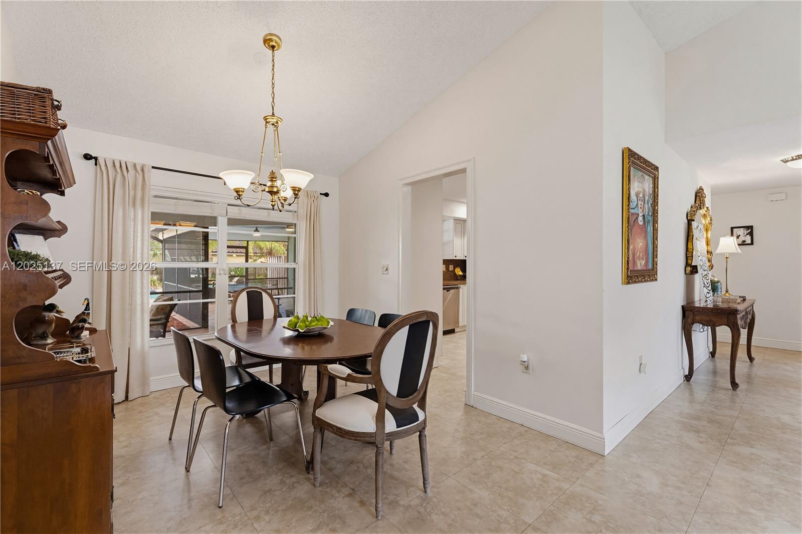 11480 Southwest 96th Terrace Miami, FL 33176 - Photo 8 of 54 a view of a dining room with furniture and chandelier
