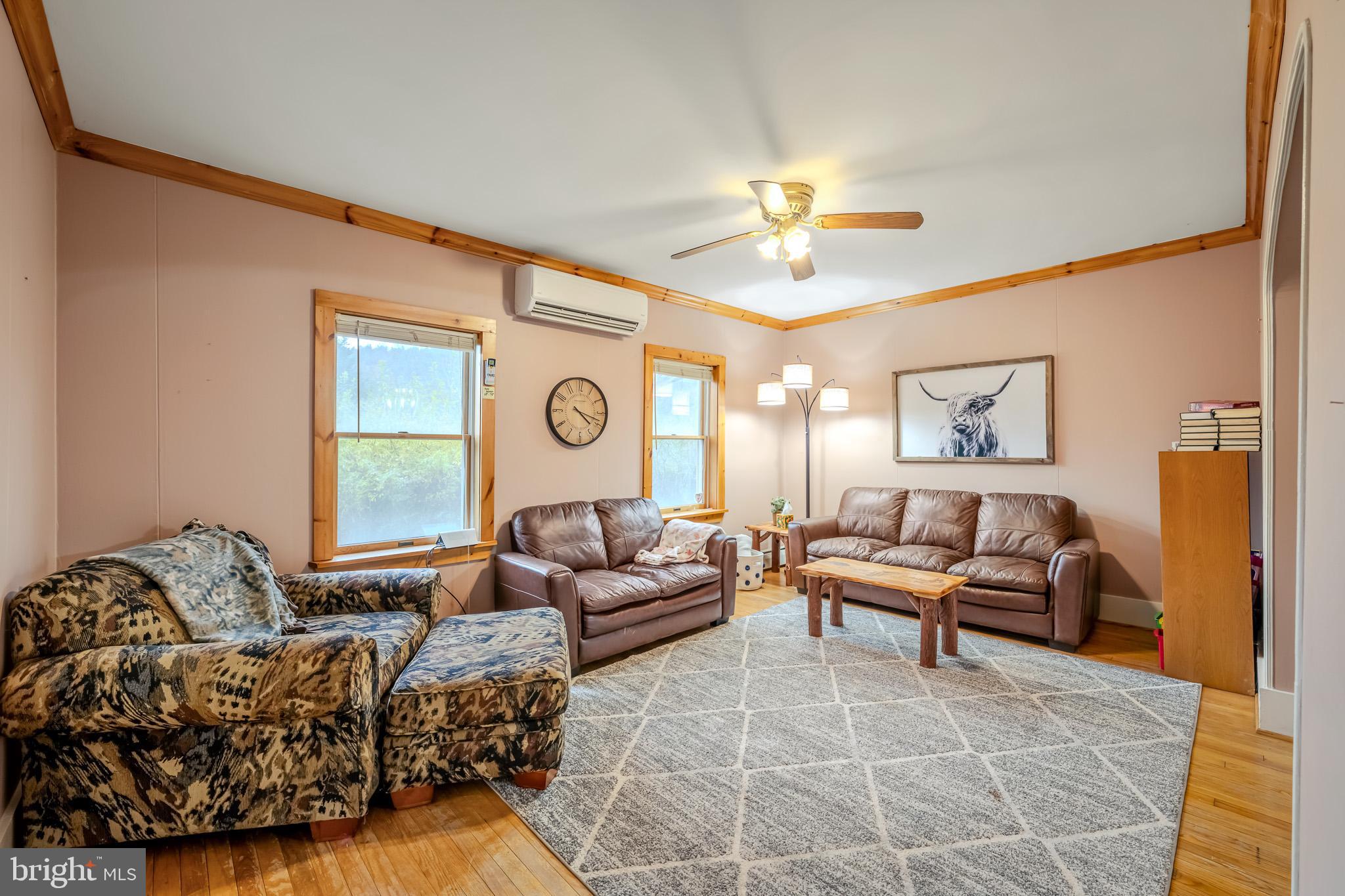 228 Huntington Creek Road Sweet Valley, PA 18656 - Photo 31 of 128 a living room with furniture and a large window