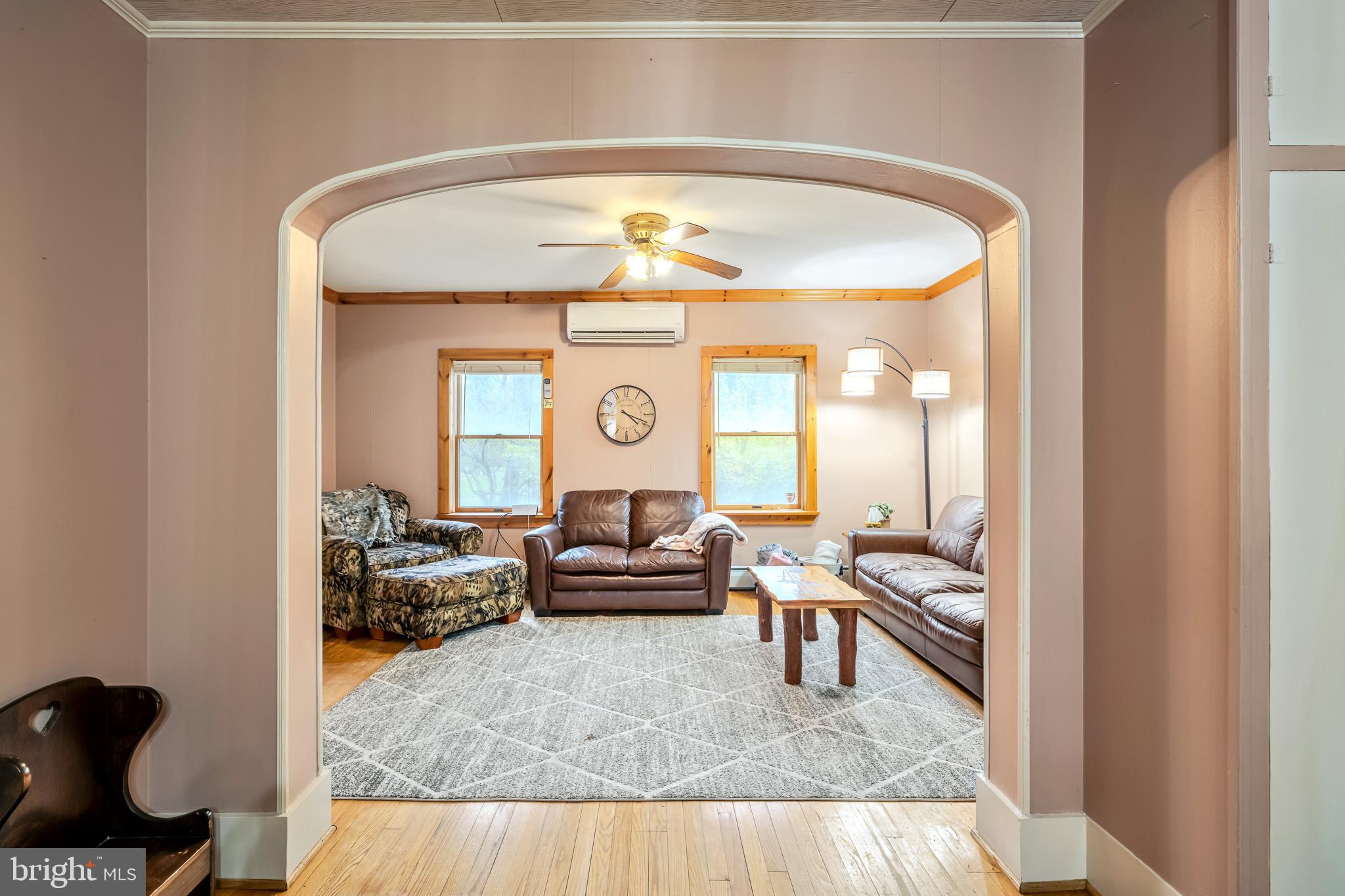 228 Huntington Creek Road Sweet Valley, PA 18656 - Photo 33 of 128 a living room with furniture and a large window