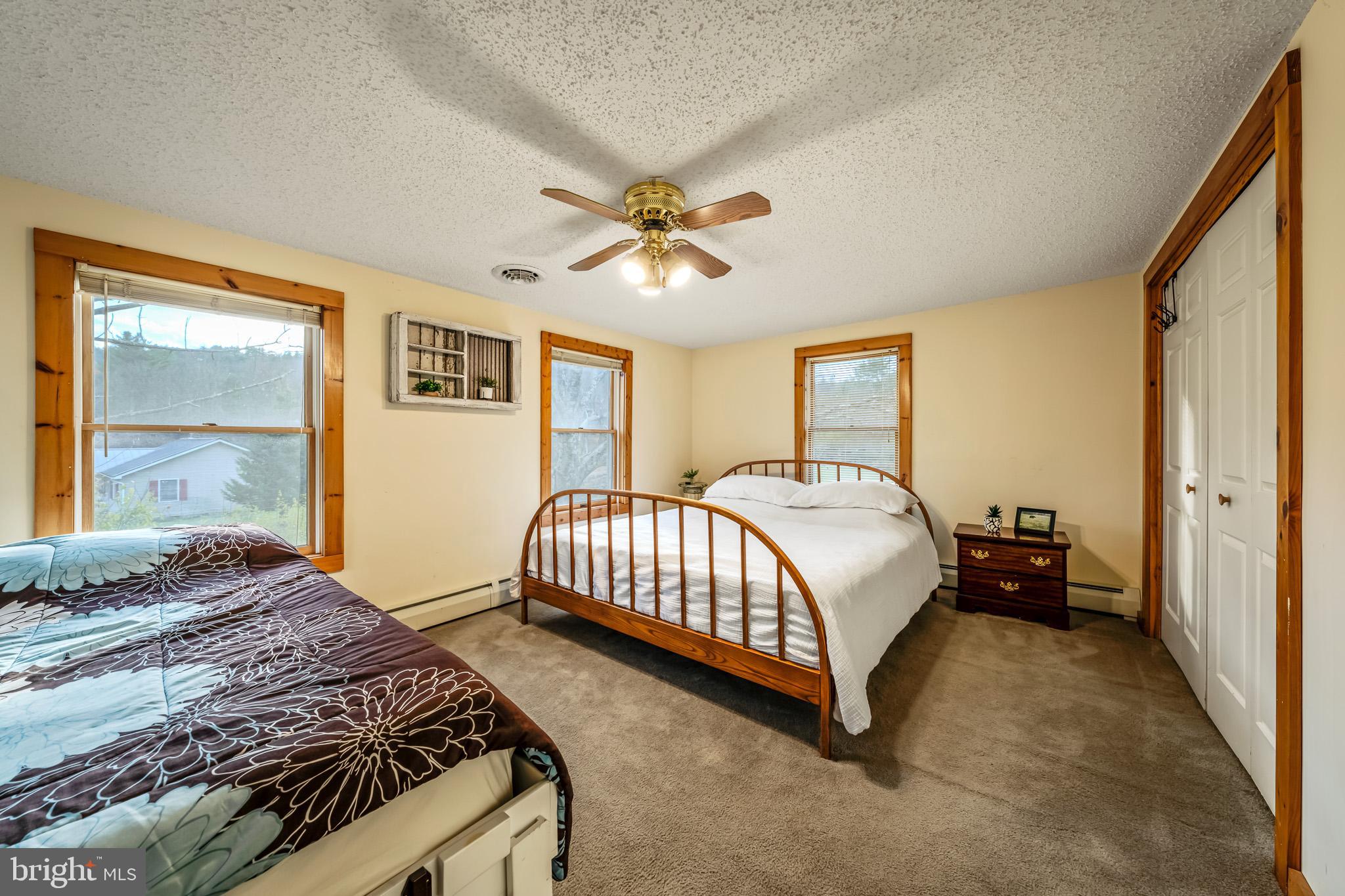 228 Huntington Creek Road Sweet Valley, PA 18656 - Photo 48 of 128 a bedroom with a bed and window
