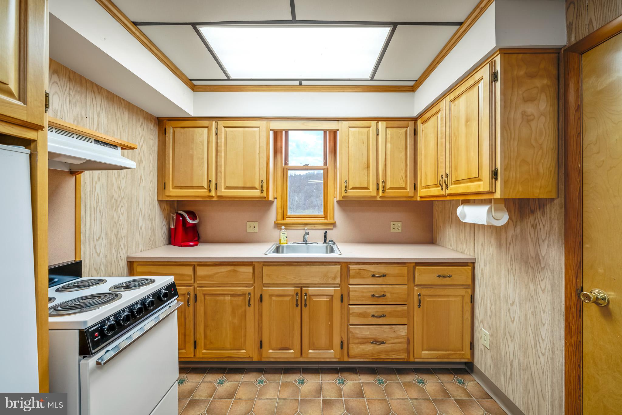 228 Huntington Creek Road Sweet Valley, PA 18656 - Photo 54 of 128 a kitchen with stainless steel appliances granite countertop a stove and a sink