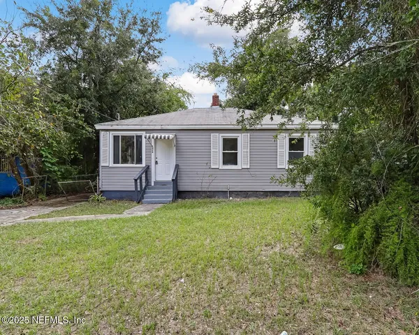 a backyard of a house with seating space
