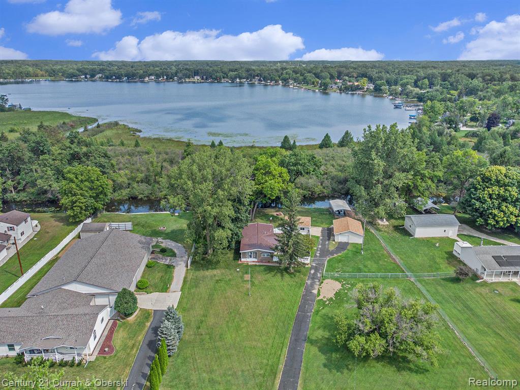 10228 Rexford Road Grass Lake, MI 49240 - Photo 23 of 24 Aerial view of property's location featuring a nearby body of water and nearby suburban area