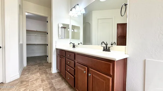 a bathroom with a sink double vanity and a mirror