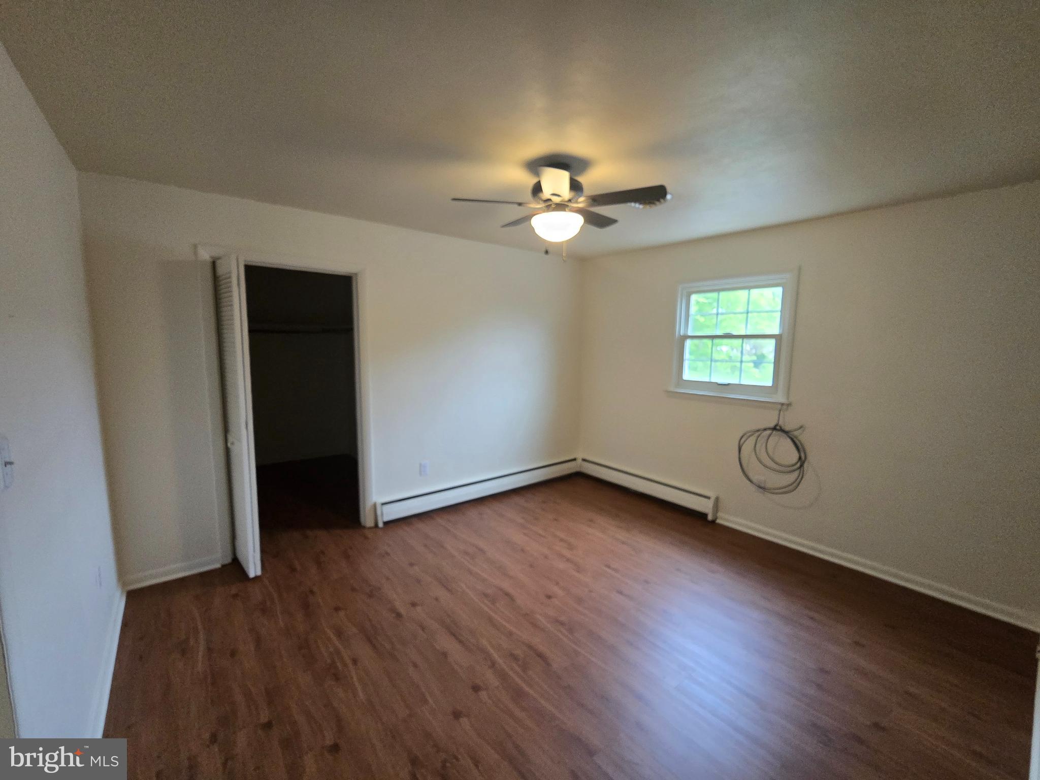 802 Sunset Avenue Gettysburg, PA 17325 - Photo 13 of 19 wooden floor in an empty room with a window