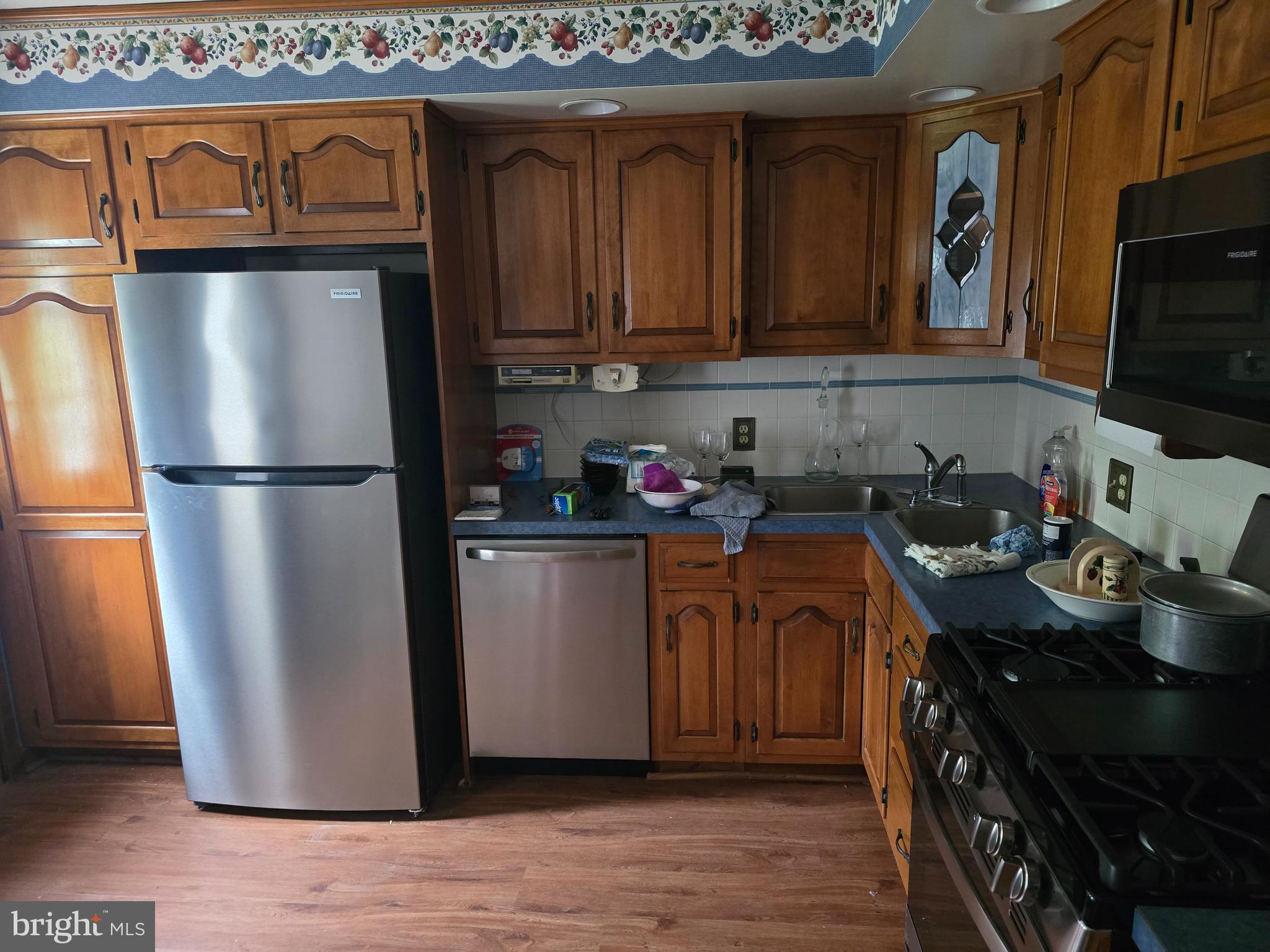 802 Sunset Avenue Gettysburg, PA 17325 - Photo 8 of 19 a kitchen with stainless steel appliances granite countertop a refrigerator a stove top oven a sink and dishwasher