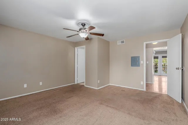 a view of a big room with carpet