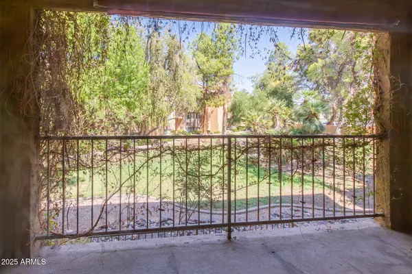 a swimming pool with outdoor seating and yard