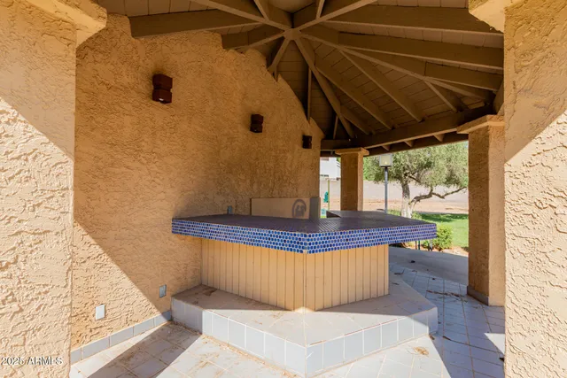 a view of a swimming pool with a patio