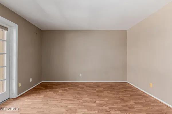 a view of an empty room and window
