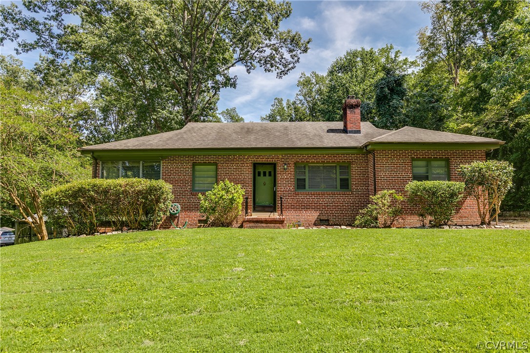 3911 Arklow Road Richmond, VA 23235 - Photo 1 of 39 a front view of a house with a yard